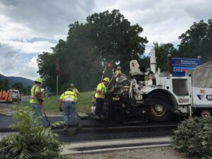 Road crew paving an asphalt roadway